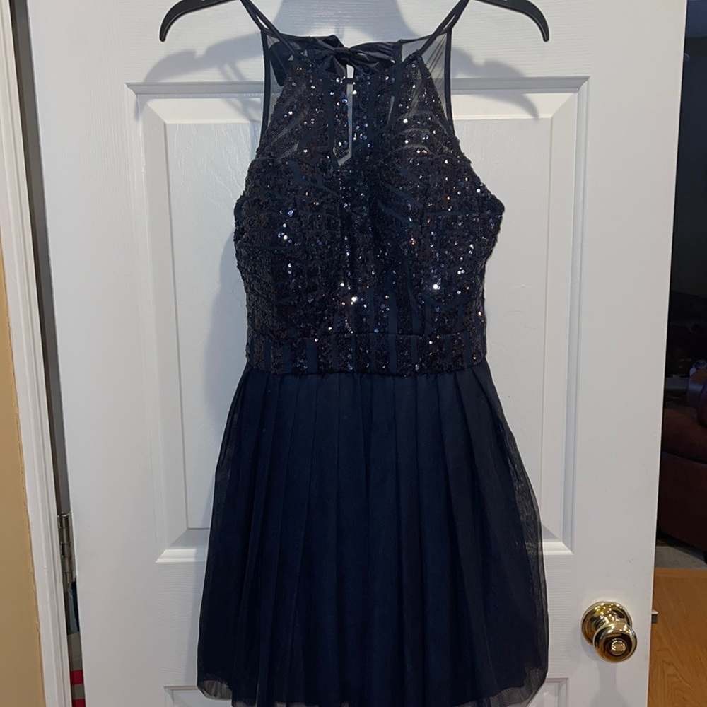 Like new navy blue women’s halter top homecoming dress.